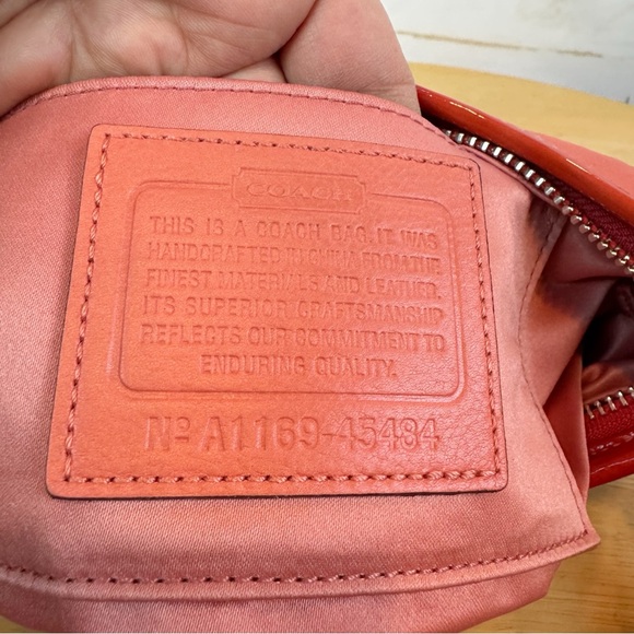 Coach | Orange Punch-Out Pattern Wristlet - Picture 13 of 13